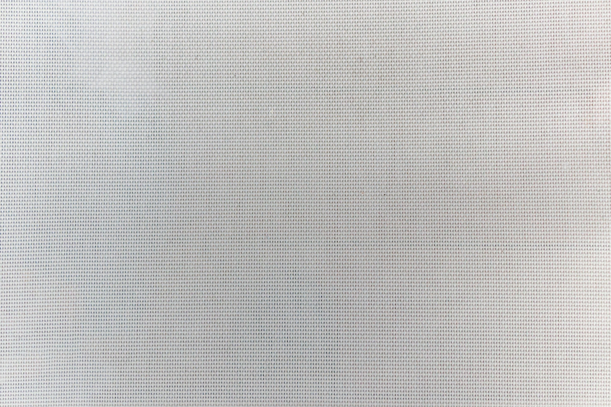 a black and white photo of a white wall